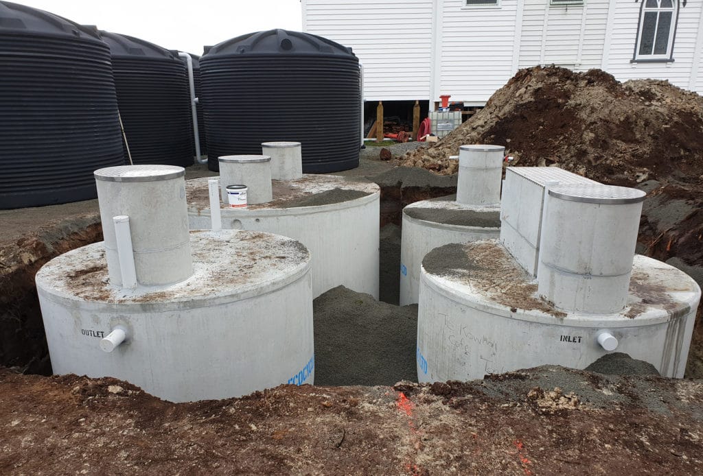 Wastewater treatment tanks being installed